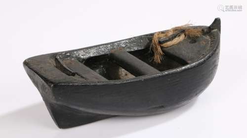 19th Century folk art toy boat, the dug out boat with nailed...