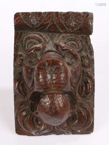 Late 17th Century carved oak lion mask, with an arched top a...