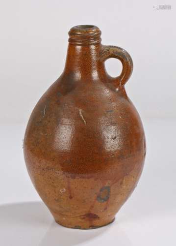 Early 18th Century salt glaze pottery jug, in brown with a s...