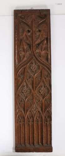 17th Century oak panel, with tracery design, flower heads an...