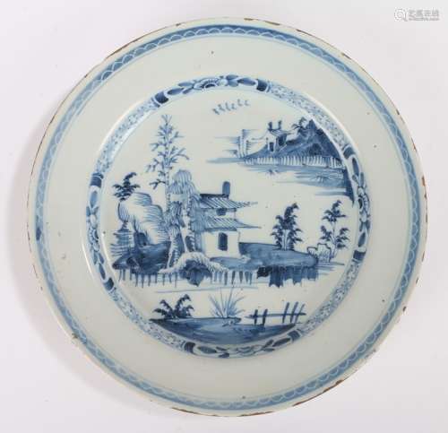 18th Century Delft charger, decorated with an Oriental scene...