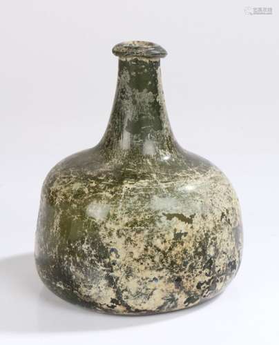 Early 18th Century green glass 'onion' wine bottle, circa 17...