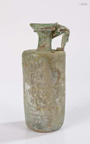 Roman glass jug, 3rd Century AD, with a wide lip above a mou...