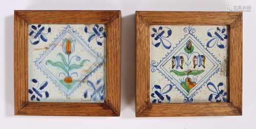 Two 18th Century Delft tiles, painted with a flower to the c...