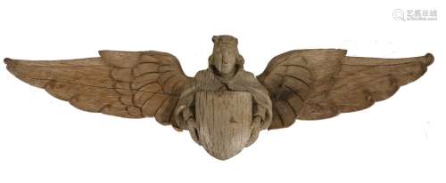 18th Century carved angel, the crowned figure holding a shie...