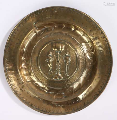 17th century German brass alms dish, with Adam and Eve embos...