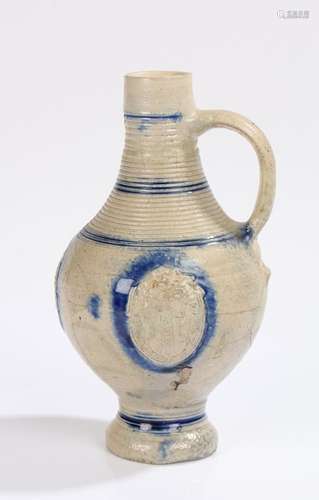 17th Century salt glazed jug, with ring decoration to the to...