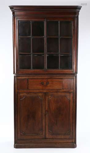George III mahogany standing corner cabinet, the concave cor...