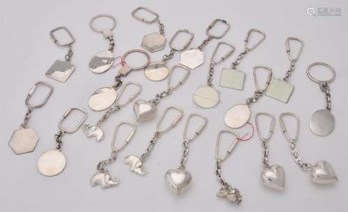 A collection of silver key rings