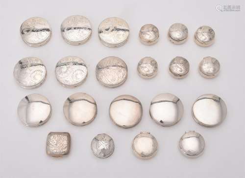 A collection of silver circular boxes