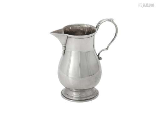 An American silver coloured baluster cream jug by Cartier