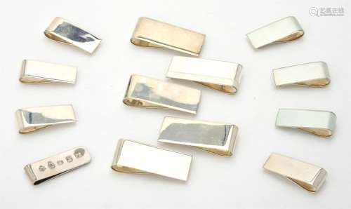 A collection of silver plain rectangular money clips