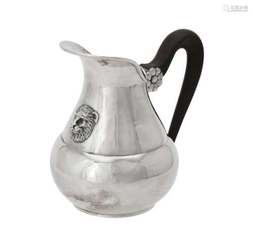An Italian silver coloured pear shaped cream jug