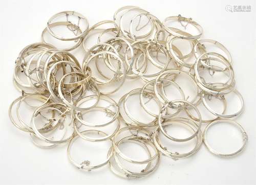 A quantity of silver coloured christening bangles