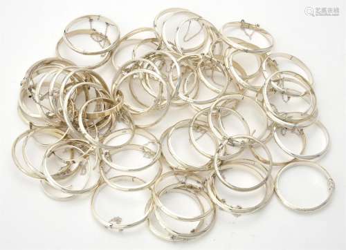 A quantity of silver coloured christening bangles