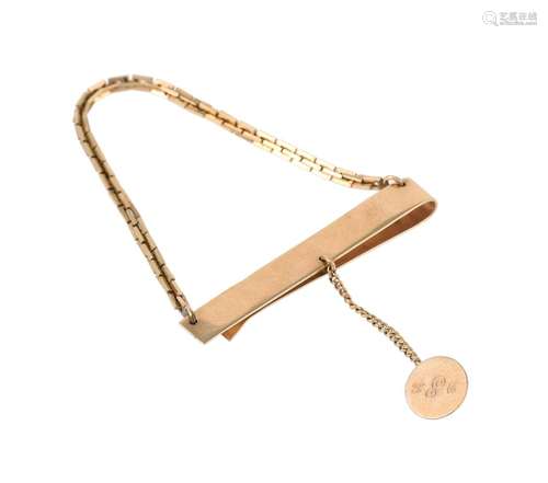 A gold coloured tie clip