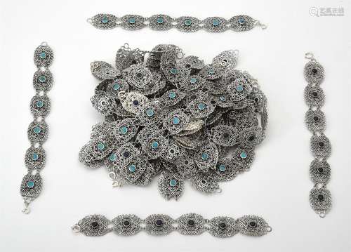 A collection of silver and silver coloured scrolled panel br...