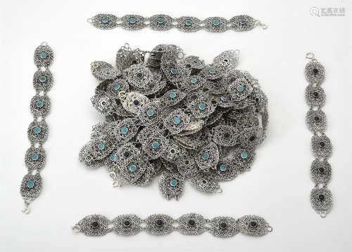 A collection of silver and silver coloured scrolled panel br...