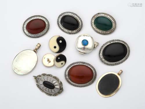 A collection of stained hardstone brooches