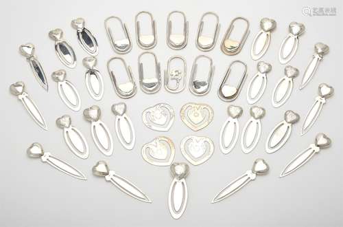 A collection of silver heart book marks and clips