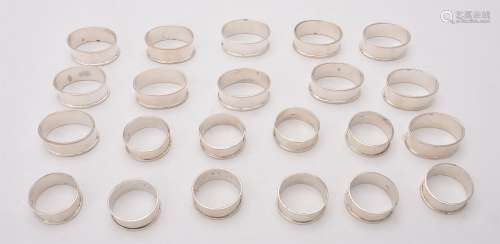 A set of ten silver circular napkin rings