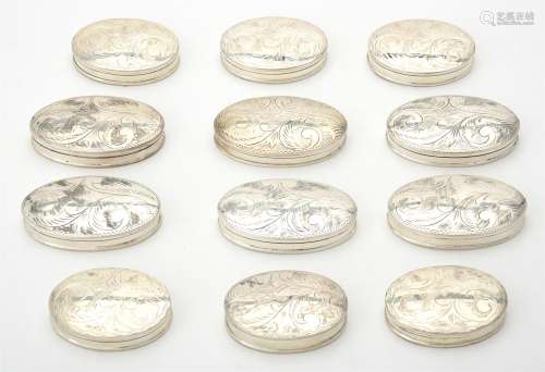 A collection of silver oval boxes