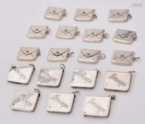A collection of silver and silver coloured stamp cases