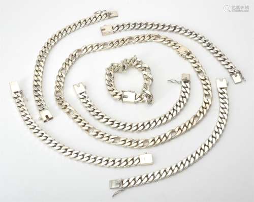 A silver Figaro link necklace