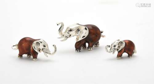 Three silver and enamel elephants