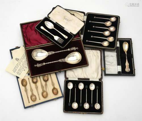 Six cased sets of silver spoons