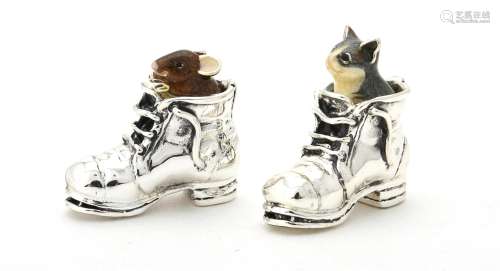 A silver and enamel model of a mouse and a cat in a boot