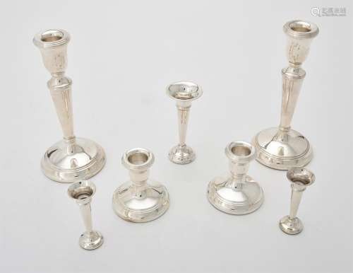 A matched pair of silver candlesticks by Ari D. Norman and L...