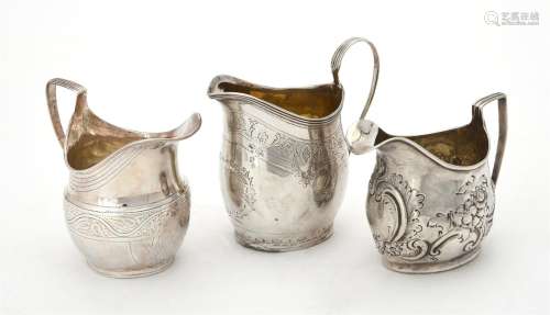 A George III silver oval baluster cream jug by Samuel & Edwa...