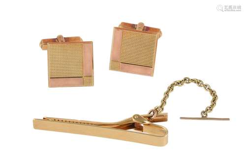 A pair of 1970s gold coloured cufflinks and a tie clip