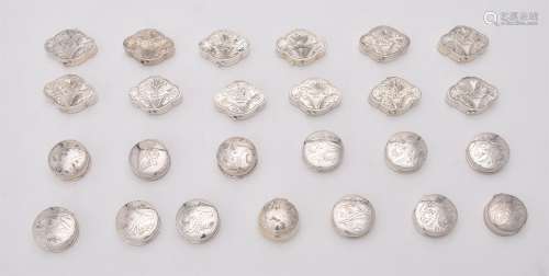 A collection of silver pill boxes