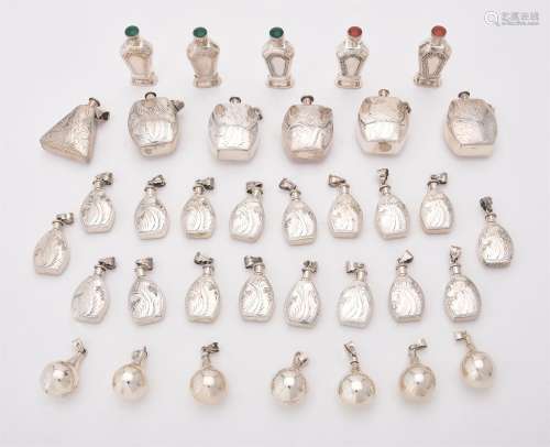 A collection of assorted silver scent bottles