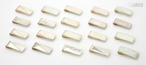 A collection of silver rectangular money clips