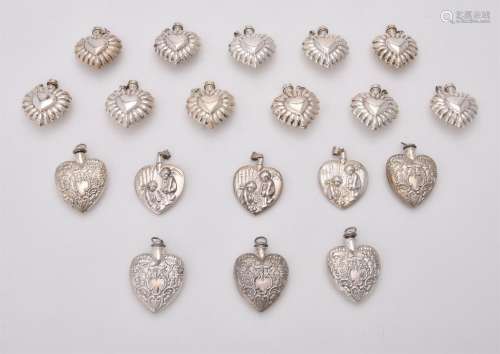 A collection of silver and silver coloured heart shaped scen...