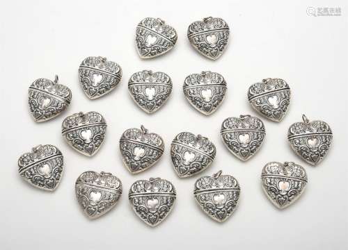 Seventeen silver heart shaped pendant boxes