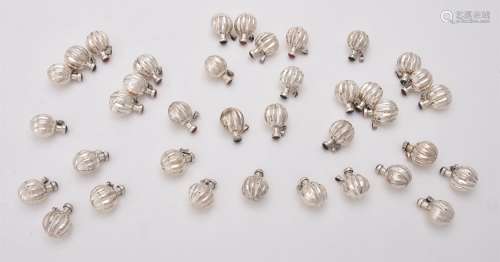 A collection of silver lobed spherical scent bottles