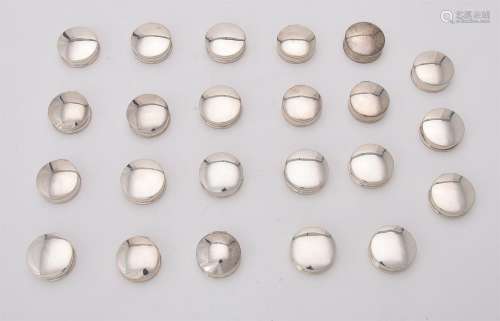 A collection of silver circular pill boxes