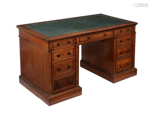 A Victorian oak and walnut pedestal desk, by Gillow & Co