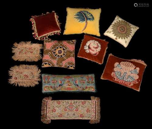 A collection of various tapestry cushions