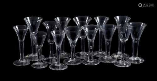 Fourteen various plain-stemmed wine glasses