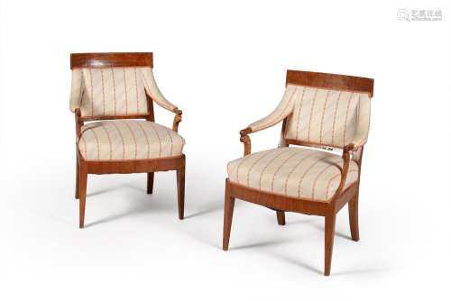 A pair of North European elm open armchairs