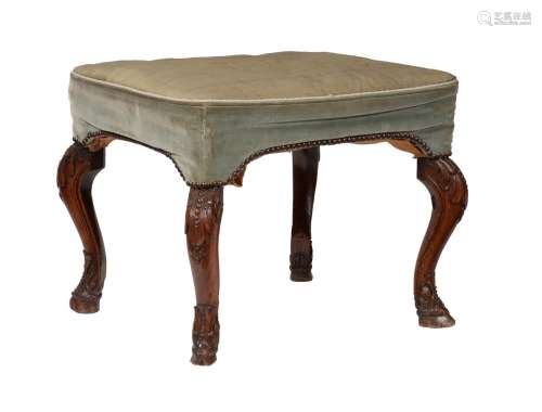 A carved walnut and upholstered stool