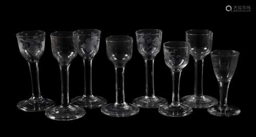 Eight various engraved plain-stemmed wine glasses