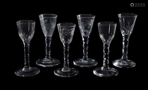 A group of six facet-stemmed wine glasses