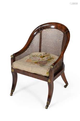 A Regency stained beech and gilt metal mounted bergere armch...