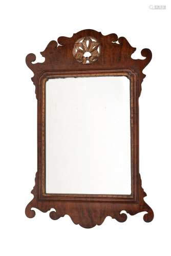 A mahogany and parcel gilt fret framed wall mirror in George...